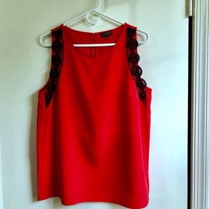 Red sleeveless blouse